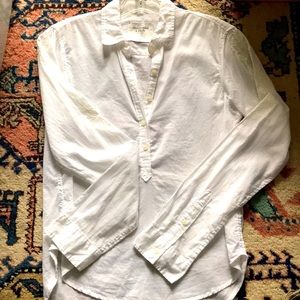 Delicate white cotton 3/4 button blouse with embroidered sleeves.